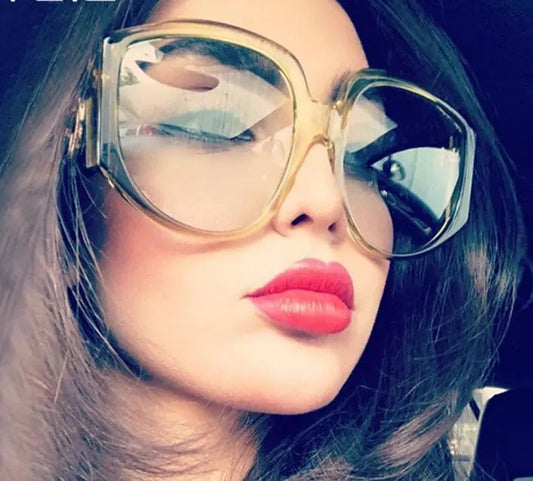 Oversize women round sun glasses with olive oversized frames on woman with red lipstick