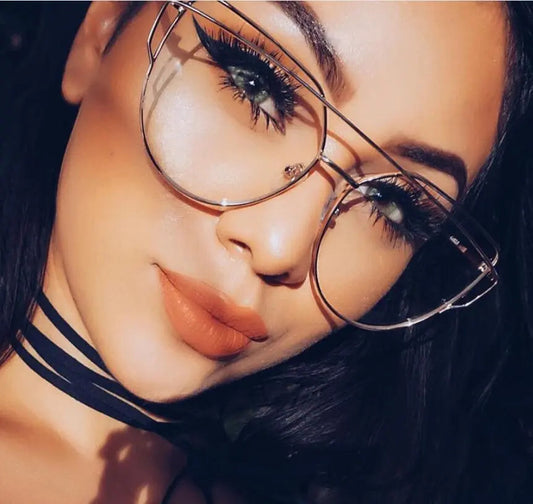 Saya Girls Sunglasses with gold full frame worn by woman with makeup and black choker